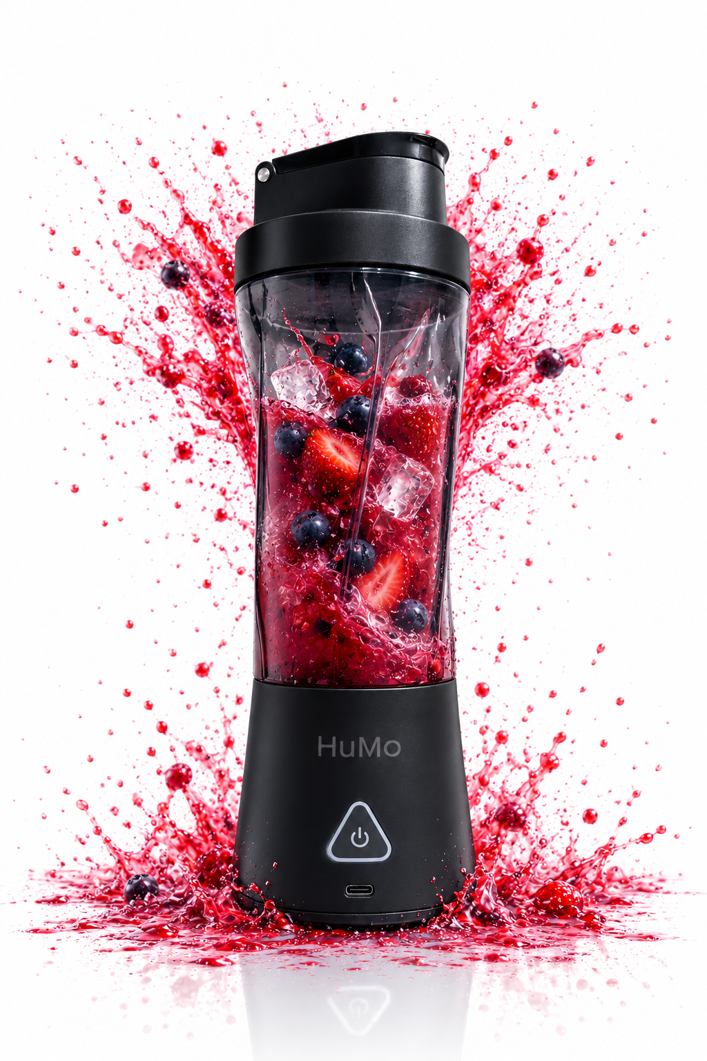 HuMo portable blender with a smoked tinted cup, berries and small ice pieces against a red berry splash.